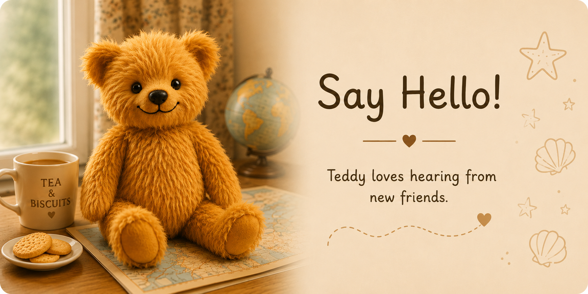 A plush golden-brown teddy bear sits on a table beside a mug that says 'TEA & BISCUIT' and a small plate of cookies, with a globe in the background. The right side has a cream panel with the text 'Say Hello! Teddy loves hearing from new friends.