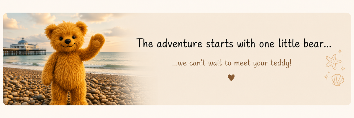 A promotional banner featuring a golden-brown teddy bear standing on a pebble beach with the ocean and pier in the background, alongside the text 'The adventure starts with one little bear.